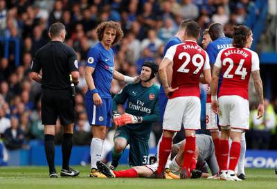 Soccer Football - Premier League - Chelsea vs Arsenal - Stamford Bridge, London, Britain - September 17, 2017   Chelsea's David Luiz is shown a yellow card by referee Michael Oliver   Action Images via Reuters/John Sibley    EDITORIAL USE ONLY. No use with unauthorized audio, video, data, fixture lists, club/league logos or "live" services. Online in-match use limited to 75 images, no video emulation. No use in betting, games or single club/league/player publications. Please contact your account representative for further details.