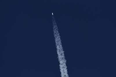 The New Shepard rocket soon after launch. The mission is Blue Origin's third manned space flight. AFP