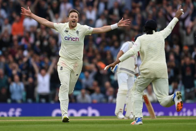 Ollie Robinson celebrates with Haseeb Hameed after dismissing Cheteshwar Pujara. Getty