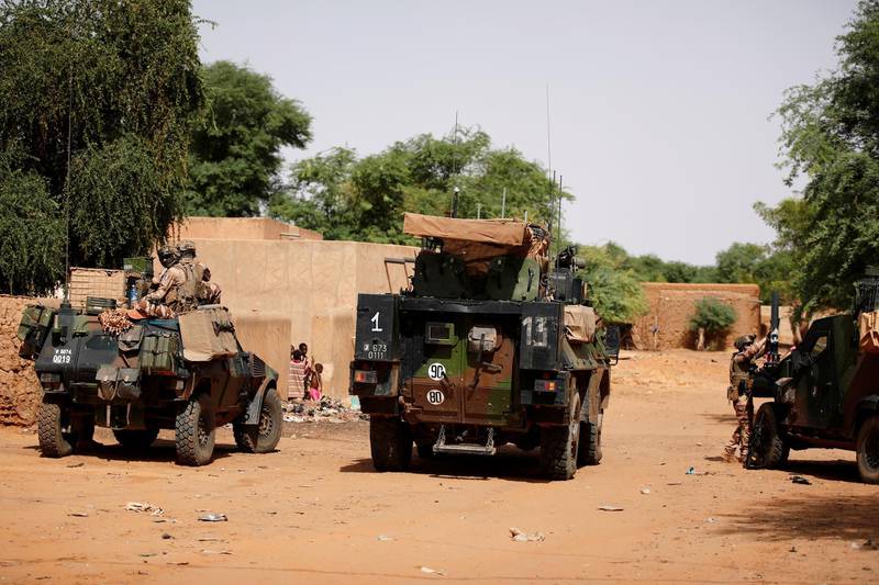 FILE PHOTO: French soldiers patrol in the streets of Gossi, Mali, July 30, 2019. Picture taken July 30, 2019. REUTERS/Benoit Tessier/File Photo