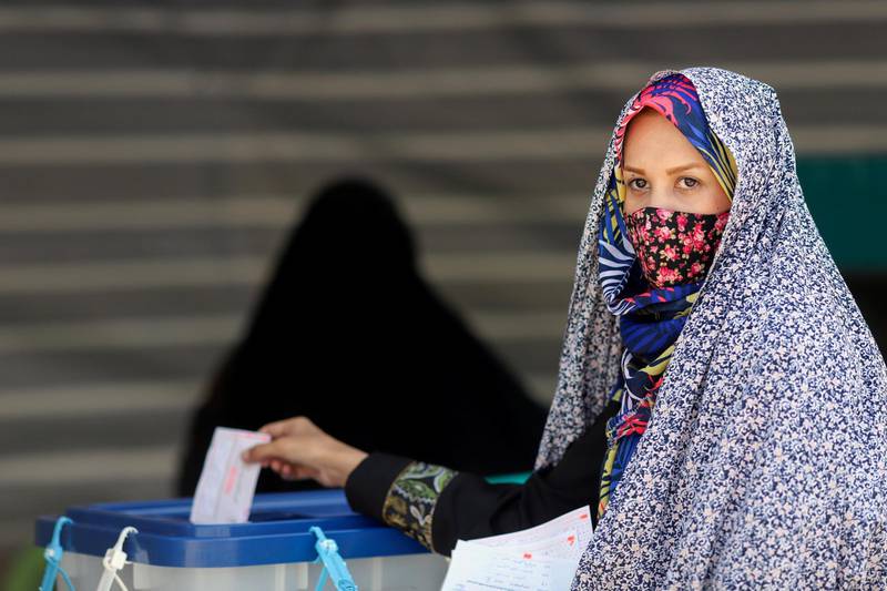 An Iranian woman casts her vote during presidential elections at a polling station in the capital Tehran. Reuters