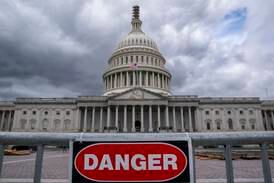 A security fence warns visitors away from a construction area at the US Capitol on Monday. AP