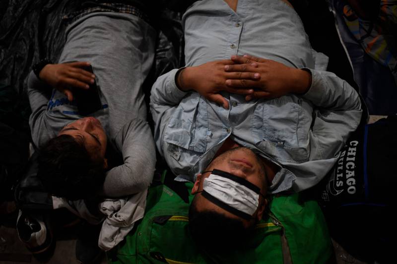 Migrants rest in Huixtla. AFP
