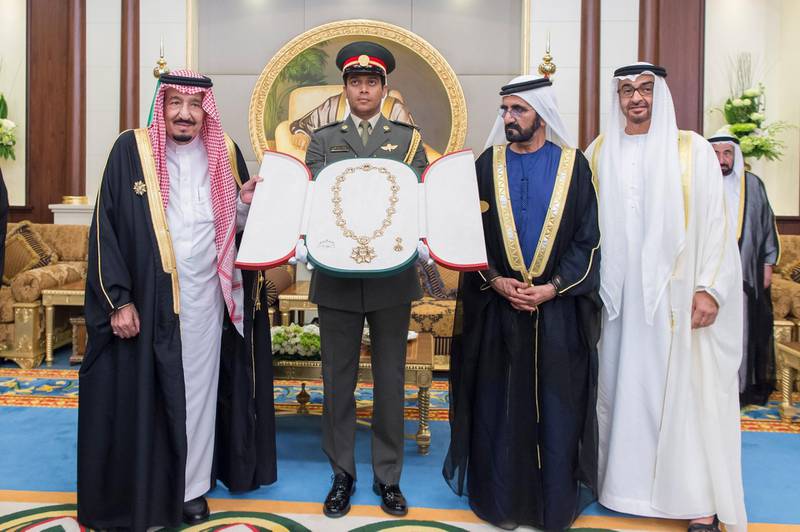 ABU DHABI, UNITED ARAB EMIRATES - 16, 03, 2016: 
HH Sheikh Mohamed bin Rashid Al Maktoum, Vice-President, Prime Minister of the UAE, Ruler of Dubai and Minister of Defence (2nd R) and HH Sheikh Mohamed bin Zayed Al Nahyan, Crown Prince of Abu Dhabi and Deputy Supreme Commander of the UAE Armed Forces (R) present a Zayed Medal to HM King Salman Bin Abdulaziz Al Saud, of Saudi Arabia and Custodian of the Two Holy Mosques (L) during a reception held at Mushrif Palace.

( Mohamed Al Suwaidi / Crown Prince Court - Abu Dhabi )
--- *** Local Caption ***  na04de-Award.jpg