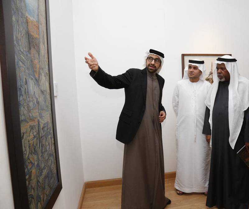 Sultan Sooud Al Qassemi shows guests around the exhibition at the Jordan National Gallery of Fine Arts in Amman. Courtesy Barjeel Art Foundation 