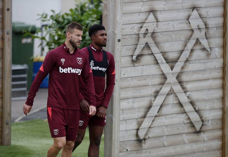 West Ham United's Andriy Yarmolenko and Ben Johnson arrive for training. Reuters