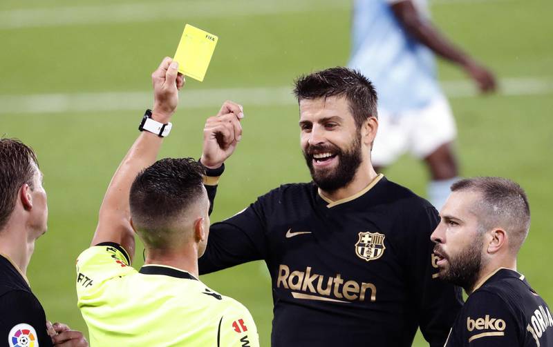 Barcelona's Gerard Pique eacts after being shown a yellow card. EPA