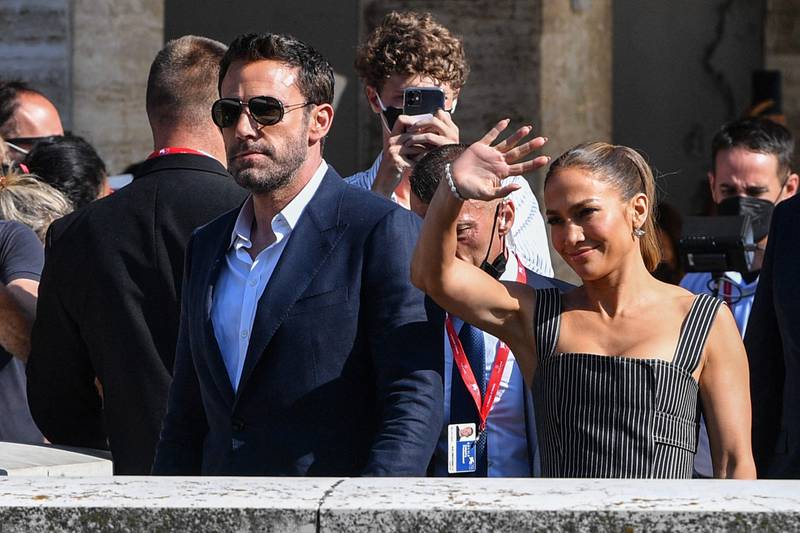 Is Lopez waving or hailing a water taxi for Affleck in Venice? AFP
