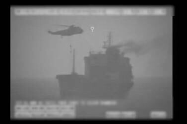 In this image made from video released by the U.S. military's Central Command, Iranian commandos fast-rope down from a helicopter onto the MV Wila oil tanker in the Gulf of Oman off the coast of the United Arab Emirates on Wednesday, Aug. 12, 2020. The Iranian navy boarded and briefly seized the Liberian-flagged oil tanker near the strategic Strait of Hormuz amid heightened tensions between Tehran and the U.S., a U.S. military official said Thursday, Aug. 13, 2020. (U.S. military's Central Command via AP)