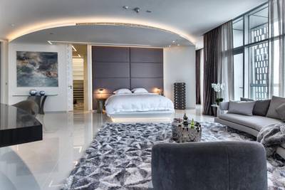 The master bedroom with his and hers dressing rooms. Courtesy LuxuryProperty.com