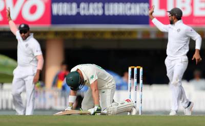 South Africa batsman Dean Elgar, center, after being hit by delivery from India bowler Umesh Yadav. AP