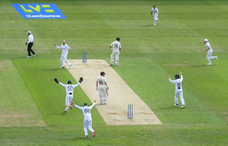 Jack Leach and his England teammates celebrate the freak wicket of Henry Nicholls for 19. Getty