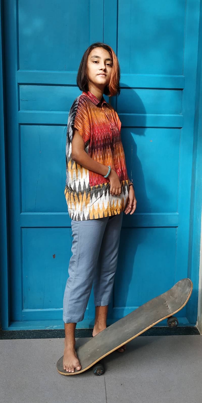 Tilotama, who has restricted movement in her arms, wears a cotton ikat magnetic shirt that allows her the autonomy to put on her own clothes. Photo: Move Ability