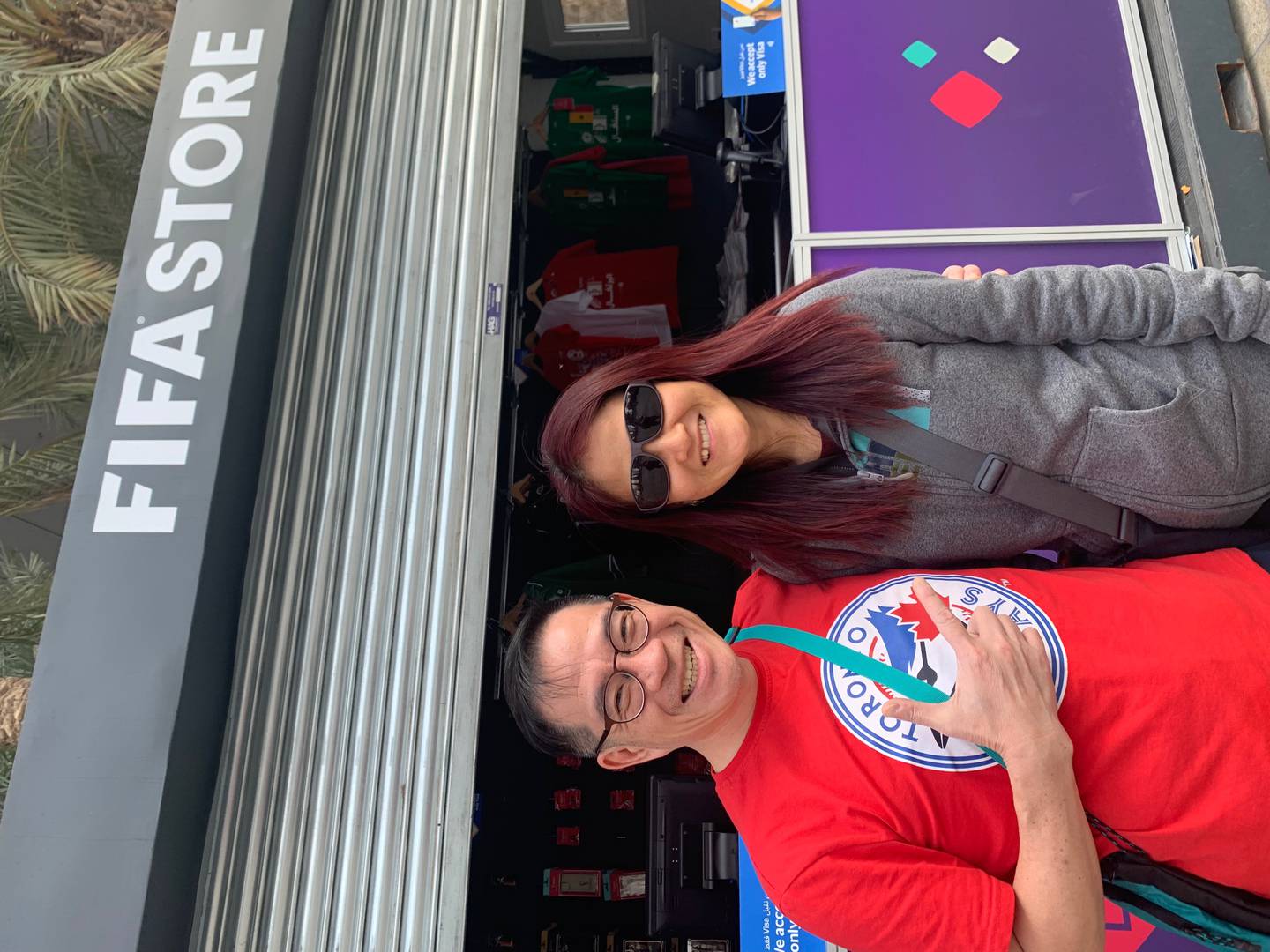 Paul Liew, pictured with his wife, said he waited for four hours in an online queue for an Argentina v Croatia ticket. Ali Al Shouk / The National