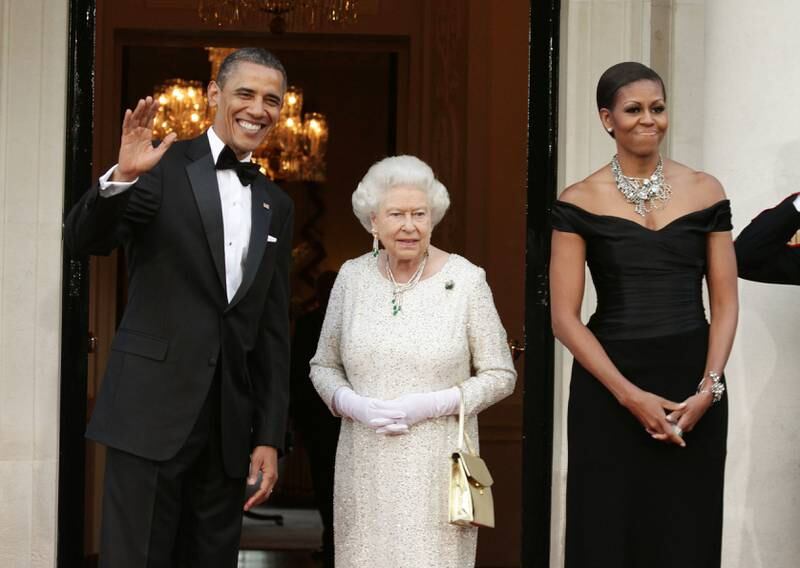 Former US President Barack Obama, Queen Elizabeth and Michelle Obama arrive at Winfield House, London, the residence of the ambassador of the US, in May 2011. Getty Images