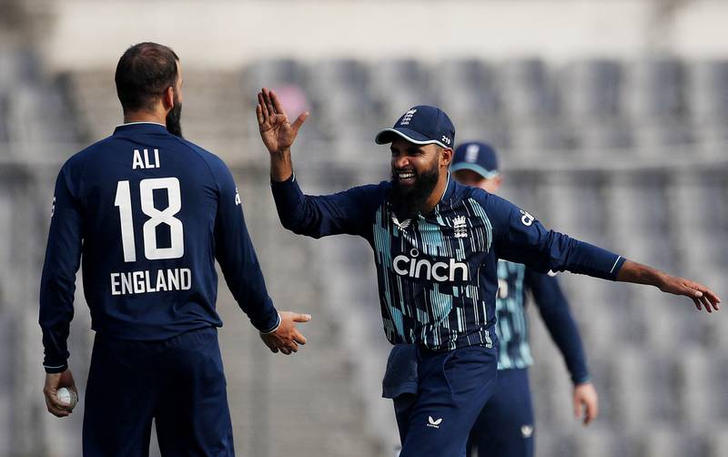 England bowler Moeen Ali celebrates with Adil Rashid after taking the wicket of Bangladesh's Taijul Islam for 10. Reuters