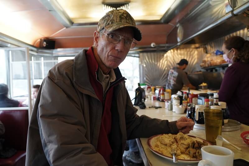 Jim Armstrong digs into breakfast in Warrenton, Virginia. Mr Armstrong blames President Biden for allowing Russia to invade Ukraine. Willy Lowry / The National