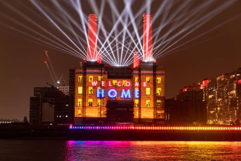 Light projections as Battersea Power Station celebrates handing over the keys to the Grade II listed building's first residents in 2021.