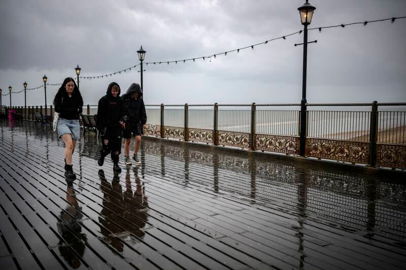 Holidaymakers brave a downpour in Skegness, Lincolnshire. Weather-dependent businesses in the UK's seaside towns had a dismal July. Getty Images
