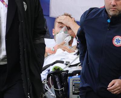 Christian Eriksen is carried off after collapsing. Reuters