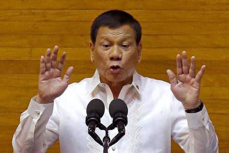 Philippine president Rodrigo Duterte gestures during his second state of the nation address at the House of Representatives in Quezon city, north of Manila, on July 24, 2017. Aaron Favila / AP