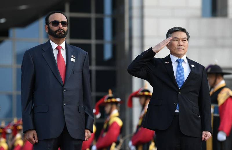 Mohammed Al Bawardi watches on as Jeong Kyeong-doo offers a salute during the military ceremony.