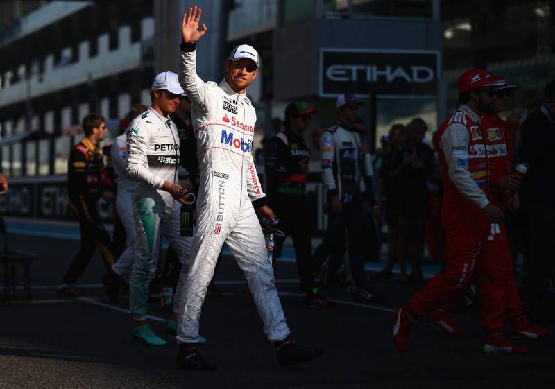 Jenson Button acknowledges the crowd during the drivers' parade. Clive Rose / Getty Images 