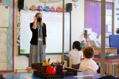 Children listen to a class led by Mrs Wright at Repton Al Barsha.