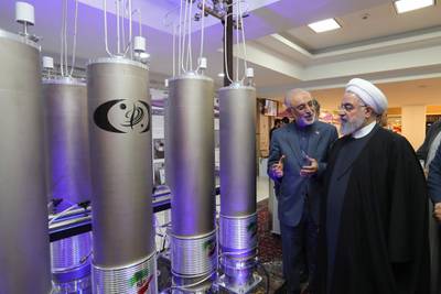 Iranian President Hassan Rouhani, right, and the head of Atomic Energy Organization of Iran Ali Akbar Salehi inspect the nuclear technology on the occasion of Iran National Nuclear Technology Day in Tehran in 2019. EPA