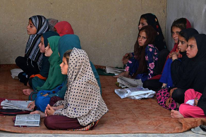 Afghan girls study at a primary school in the the Panjwai district of Kandahar. AFP 