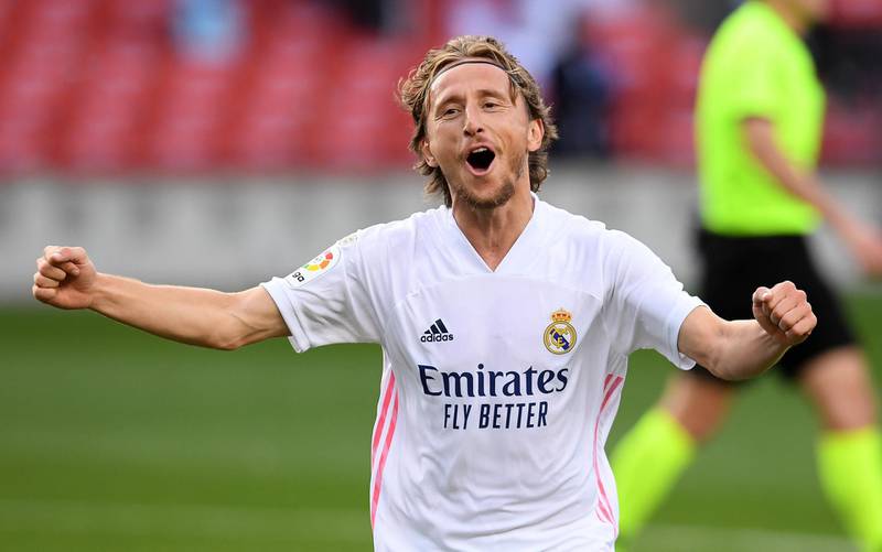BARCELONA, SPAIN - OCTOBER 24: Luka Modric of Real Madrid  celebrates after scoring his team's third goal  during the La Liga Santander match between FC Barcelona and Real Madrid at Camp Nou on October 24, 2020 in Barcelona, Spain. Sporting stadiums around Spain remain under strict restrictions due to the Coronavirus Pandemic as Government social distancing laws prohibit fans inside venues resulting in games being played behind closed doors. (Photo by Alex Caparros/Getty Images)