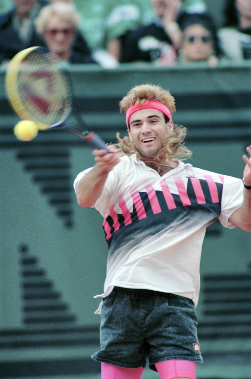 American Andre Agassi hits the ball in his match against Ecuadorian Andres Gomez during the Men's French Open final on  june 10, 1990 at Roland Garros stadium. Eight-time grand slam champion Agassi admitted in his autobiography, called Open, that he'd taken the highly-addictive drug crystal methamphetamine and then lied to the Association of Tennis Professionals (ATP) to escape a ban.
AFP PHOTO PIERRE VERDY (Photo by PIERRE VERDY / AFP)
