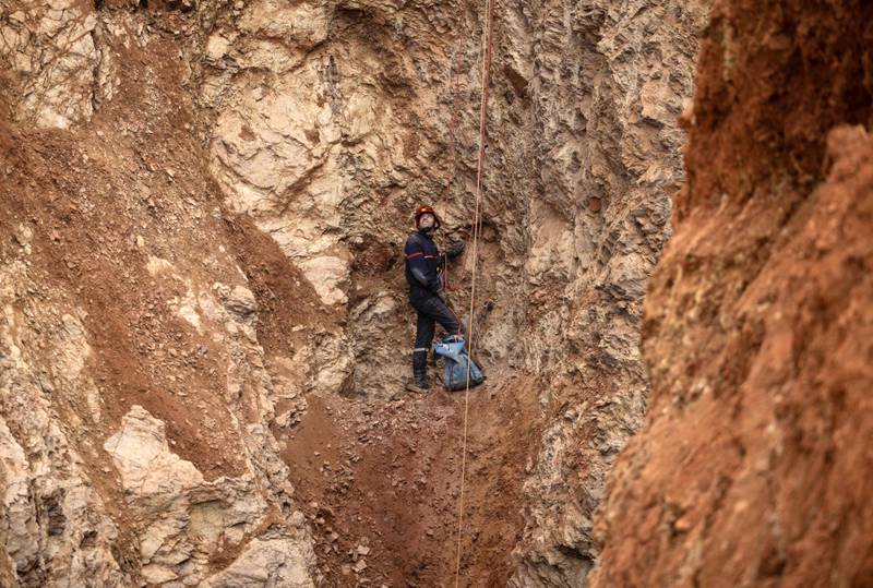 A Moroccan emergency services climber surveys the site. AFP