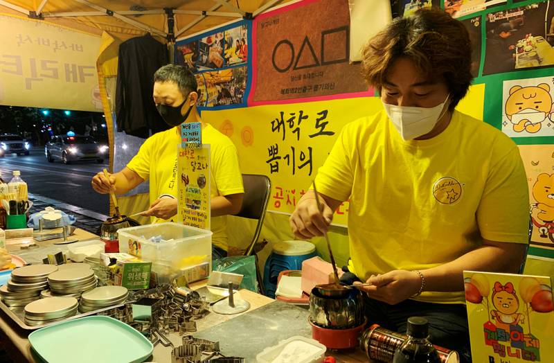 An Yong-hui, 37, has been making dalgona for the past eight years in a university district in the capital Seoul. Reuters