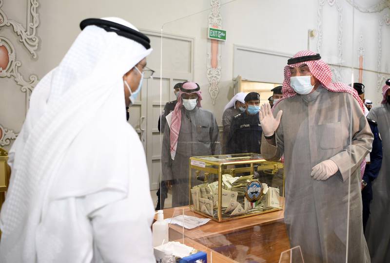 Kuwaiti Prime Minister Sheikh Sabah al-Khaled al-Sabah, wearing a protective mask visit one of the polling station in Kuwait City. EPA