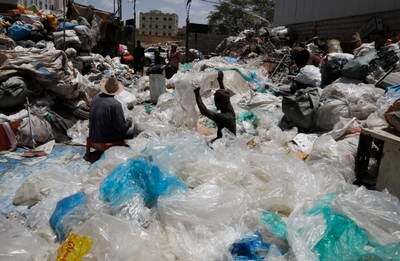 Workers sort plastic items for recycling. Poor people in Yemen collect plastic materials from the streets and then sell them to junkyards where being sorted
