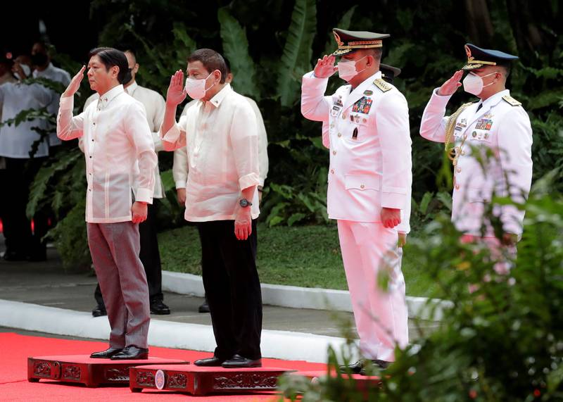 The leaders salute during the inauguration ceremony. AFP