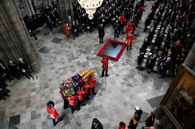 The coffin of Queen Elizabeth is carried by the Bearer Party into Westminster Abbey. Getty