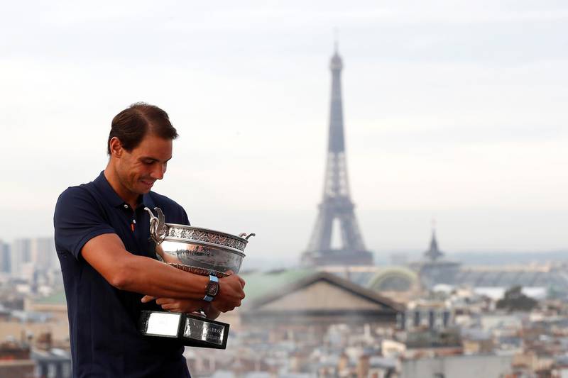 Rafael Nadal poses with the French Open trophy on the Galeries Lafayette Rooftop, Paris, a day after crushing Novak Djokovic in the men's final. Reuters
