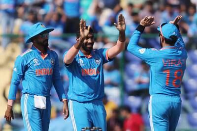 India's Jasprit Bumrah celebrates with Virat Kohli and teammates after taking the wicket of Afghanistan's Ibrahim Zadran, caught by KL Rahul. Reuters