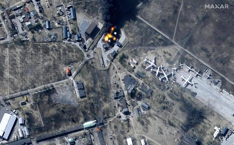 An overview of damaged buildings and burning fuel storage tanks at Antonov Airport in Hostomel, north-west of Kyiv. Maxar Technologies  /  AFP