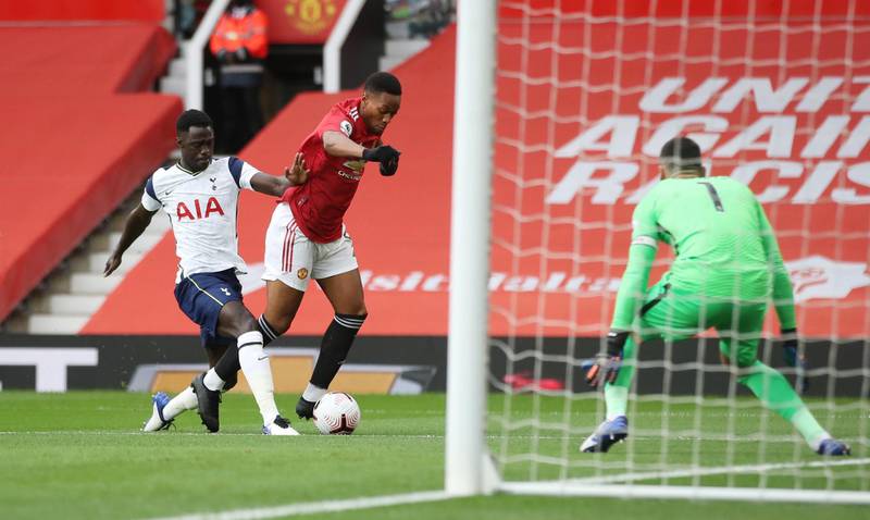 Spurs defender Davinson Sanchez fouls Anthony Martial and gives away a second-minute penalty at Old Trafford. Reuters