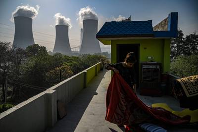 Smoke rises from the chimney stacks of a National Thermal Power Corporation plant in Dadri, India. AFP