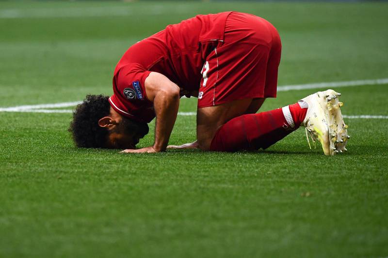 Liverpool's Egyptian forward Mohamed Salah celebrates after scoring the opening goal during the UEFA Champions League final football match between Liverpool and Tottenham Hotspur at the Wanda Metropolitano Stadium in Madrid on June 1, 2019. (Photo by GABRIEL BOUYS / AFP)