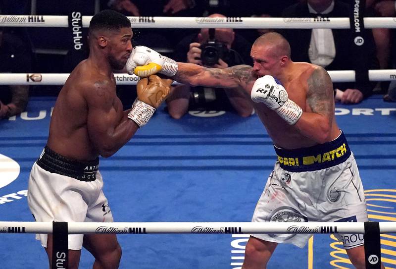 Oleksandr Usyk lands a punch on Athony Joshua on his way to victory in their WBA, IBF and WBO heavyweight title fight at Tottenham Hotspur Stadium in London on September 25. PA