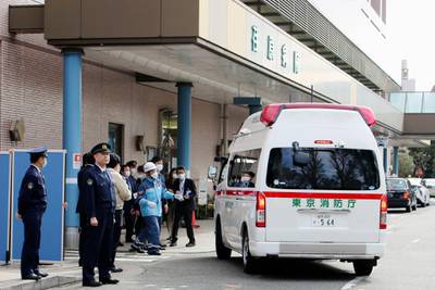 An ambulance carrying evacuees from Wuhan, China, arrives at Ebara Hospital in Tokyo after the first group of Japanese evacuees returned from the virus-hit Chinese city. AP