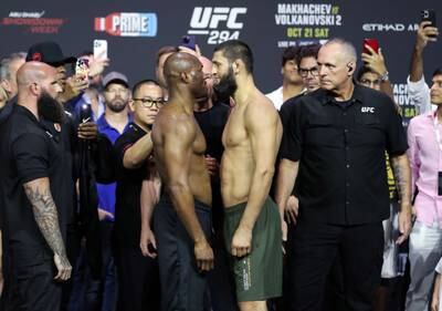 UFC Middleweight Kamaru Usman, left, and Khamzat Chimaev face off at the ceremonial weigh in before their fight at UFC 294 in Abu Dhabi. Chris Whiteoak / The National