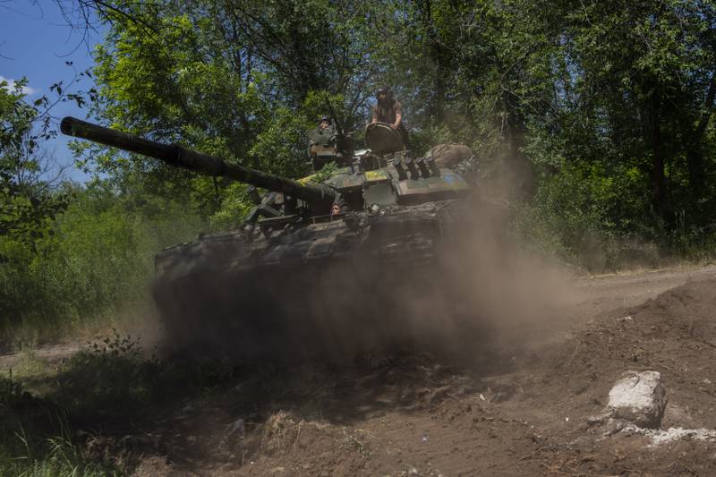 Ukrainian servicemen manoeuvre a tank near the frontline in the Donetsk region. AP Photo