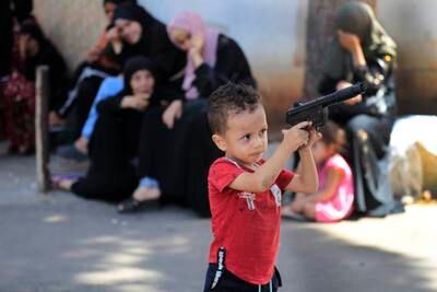 This Palestinian boy’s family fled their home after clashes at the refugee camp. AP