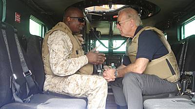 This 06 September, 2007 photo, courtesy of US Senator Joseph Biden's office, shows the Delaware Senator speaking with an unidentified soldier inside a Mine Resistant Ambush Protected (MRAP) vehicle during a visit to Ramadi, Iraq. AFP PHOTO/HO/Courtesy of Senator Biden's office/RESTRICTED TO EDITORIAL USE/ GETTY OUT (Photo by HO / Joe Biden / AFP)